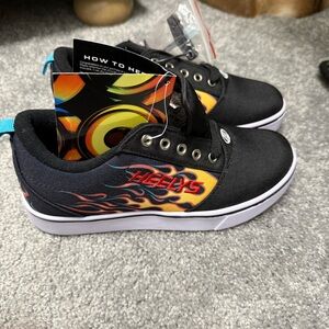 Heelys Black Sneakers with Orange Flame Design for kids size 5 brand new